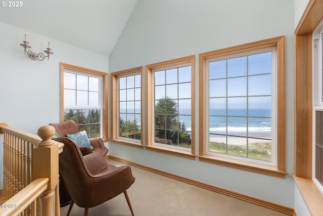 5340 Haystack Dr, Neskowin, OR 97149 - living area featuring carpet flooring, plenty of natural light, a water view, and high vaulted ceiling