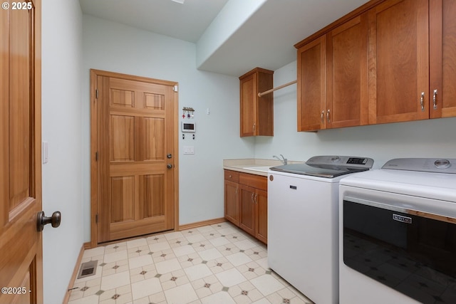 5340 Haystack Dr, Neskowin, OR 97149 - washroom with washer and clothes dryer, cabinet space, and light floors