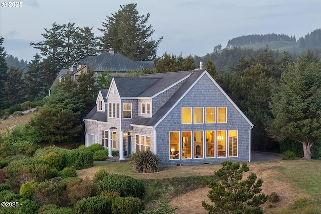 5340 Haystack Dr, Neskowin, OR 97149 - rear view of property featuring a forest view and roof with shingles