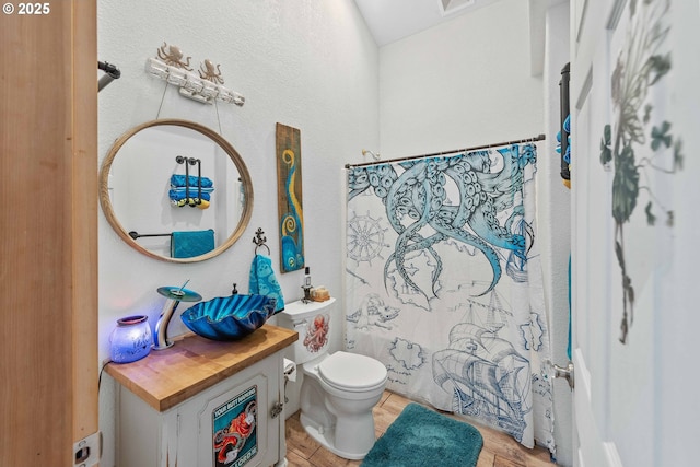full bathroom with vanity, toilet, wood finished floors, and a shower with shower curtain