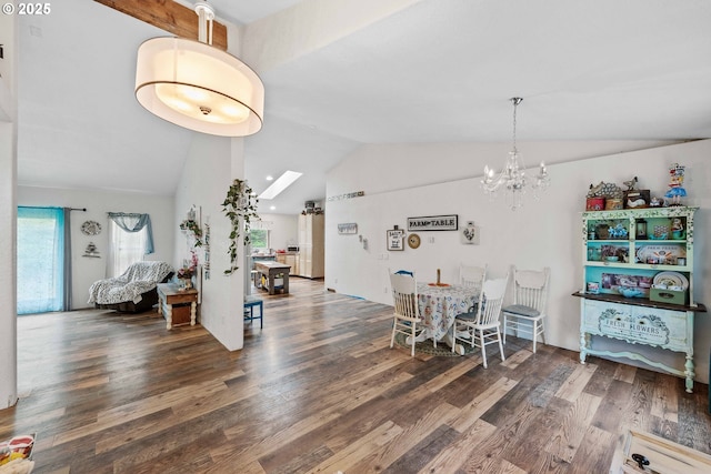 dining space with a notable chandelier, wood finished floors, and lofted ceiling with skylight