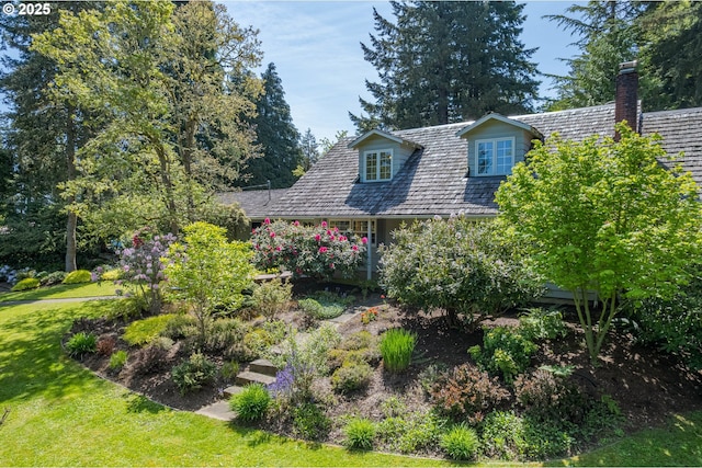 view of front of property with a front lawn and a chimney
