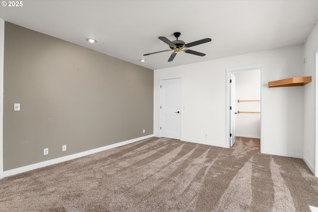 unfurnished bedroom featuring carpet and ceiling fan