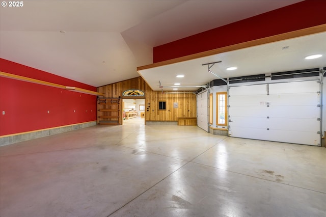 garage featuring wooden walls