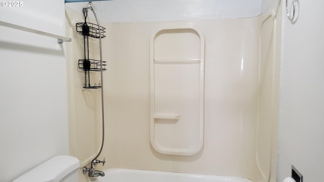 bathroom featuring toilet and shower / tub combination