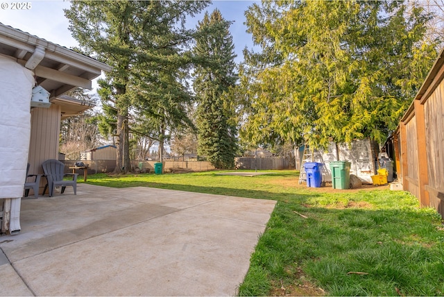 view of yard featuring a patio and a fenced backyard