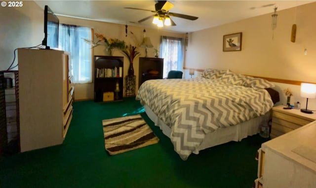 bedroom with dark carpet and a ceiling fan