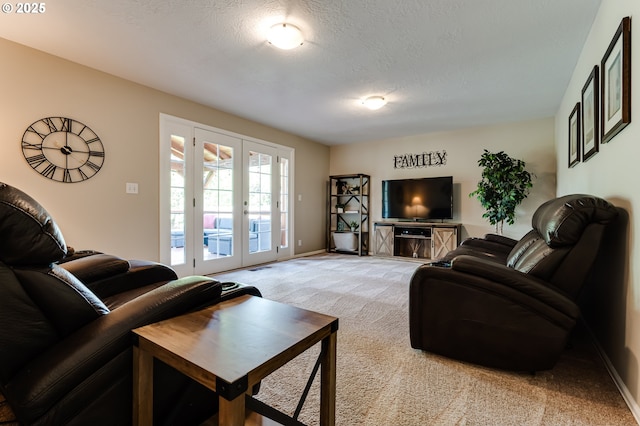 living area with french doors, a textured ceiling, baseboards, and light colored carpet
