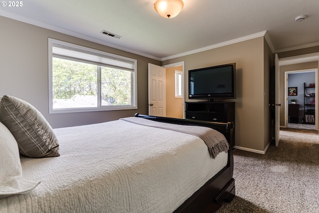 carpeted bedroom featuring crown molding, baseboards, and visible vents