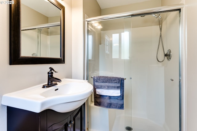 bathroom featuring vanity and a stall shower