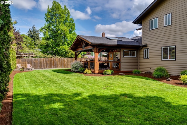 view of yard with fence and a wooden deck