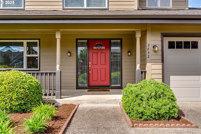 property entrance with a garage and covered porch