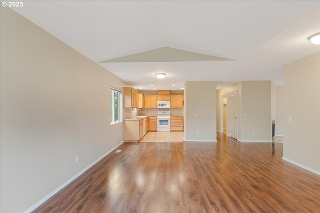 59546 Catarin St, Saint Helens, OR 97051 - unfurnished living room with wood finished floors and vaulted ceiling