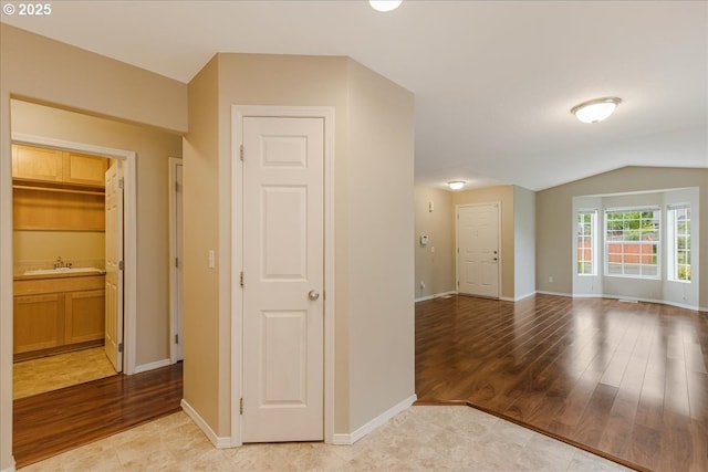 59546 Catarin St, Saint Helens, OR 97051 - corridor featuring light wood finished floors and vaulted ceiling