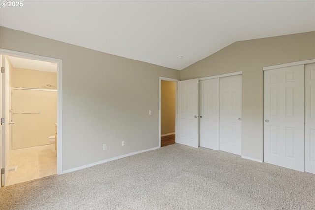 59546 Catarin St, Saint Helens, OR 97051 - unfurnished bedroom with carpet, lofted ceiling, multiple closets, and connected bathroom