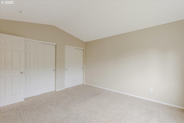 59546 Catarin St, Saint Helens, OR 97051 - unfurnished bedroom with vaulted ceiling, multiple closets, and carpet flooring