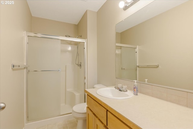 59546 Catarin St, Saint Helens, OR 97051 - full bathroom with a stall shower, vanity, decorative backsplash, and tile patterned floors