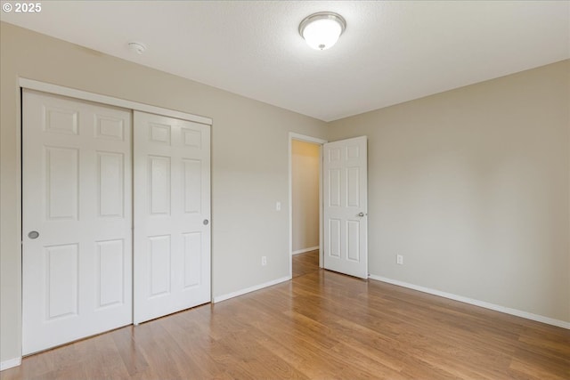 59546 Catarin St, Saint Helens, OR 97051 - unfurnished bedroom with light wood-style flooring and a closet