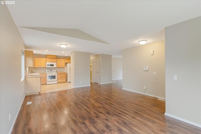 59546 Catarin St, Saint Helens, OR 97051 - unfurnished living room with vaulted ceiling, wood finished floors, and recessed lighting