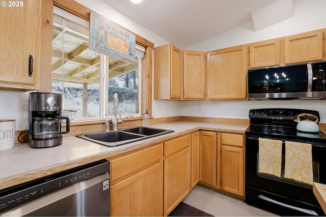 8095 SW High Cone Dr, Terrebonne, OR 97760 - kitchen with appliances with stainless steel finishes, a sink, light countertops, light brown cabinetry, and vaulted ceiling