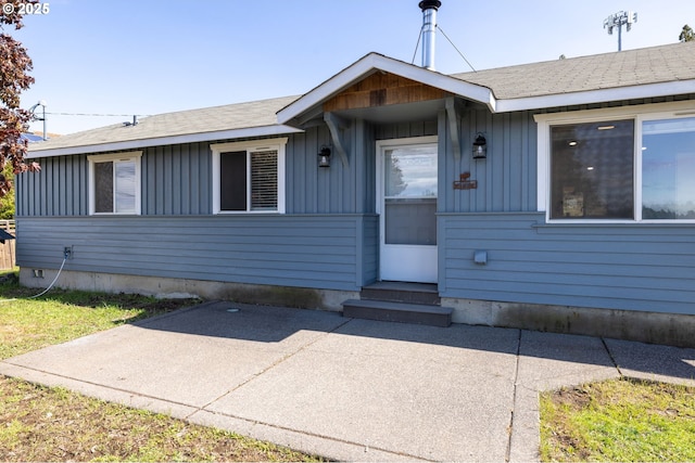 8095 SW High Cone Dr, Terrebonne, OR 97760 - view of front facade with board and batten siding and a patio area