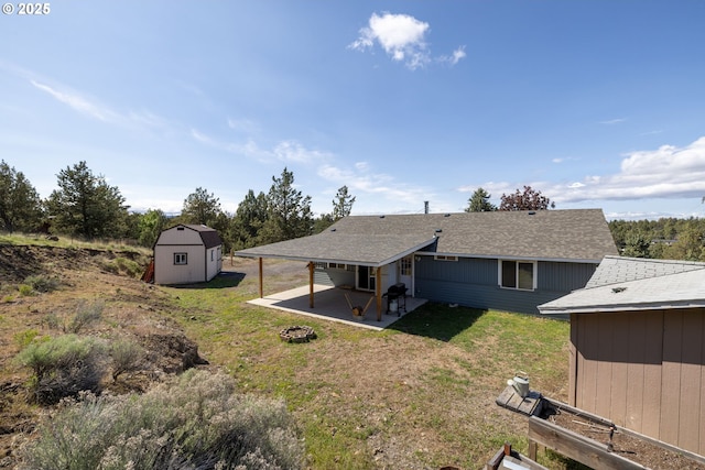 8095 SW High Cone Dr, Terrebonne, OR 97760 - back of property featuring a patio, a lawn, and roof with shingles