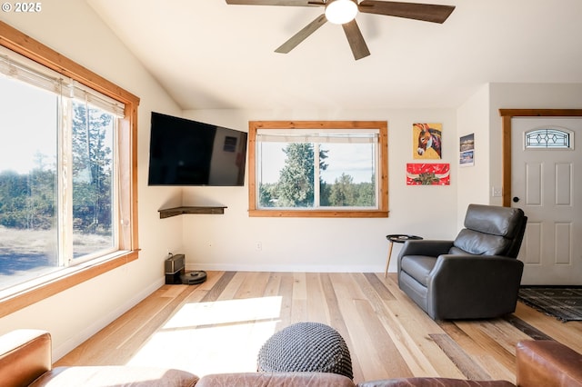 8095 SW High Cone Dr, Terrebonne, OR 97760 - living room with plenty of natural light, wood finished floors, ceiling fan, baseboards, and lofted ceiling
