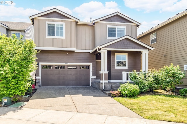craftsman-style home with board and batten siding, concrete driveway, a garage, and covered porch