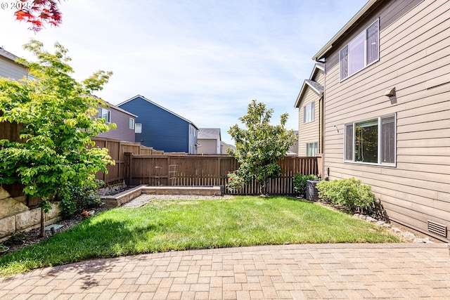 view of yard with a patio area and cooling unit