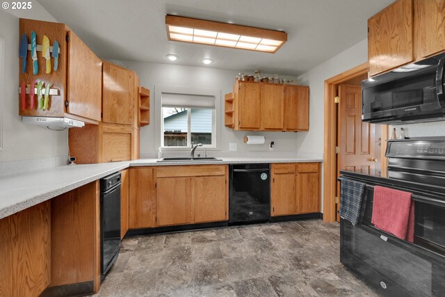 kitchen with open shelves, light countertops, brown cabinetry, a sink, and black appliances