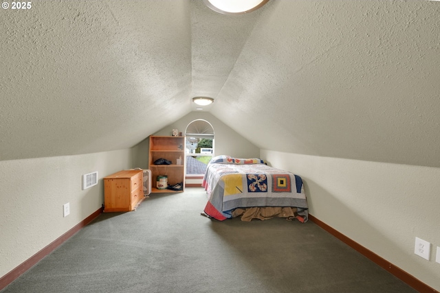 bedroom with lofted ceiling, carpet, visible vents, and baseboards