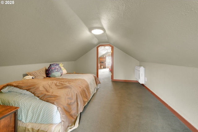 bedroom featuring baseboards, radiator, vaulted ceiling, a textured ceiling, and carpet flooring