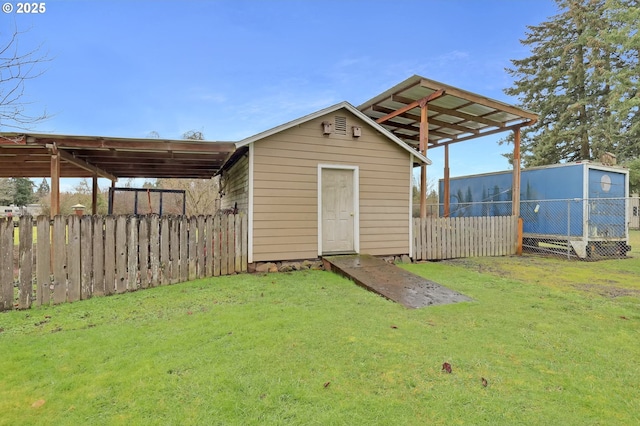 view of outdoor structure with fence and an outdoor structure