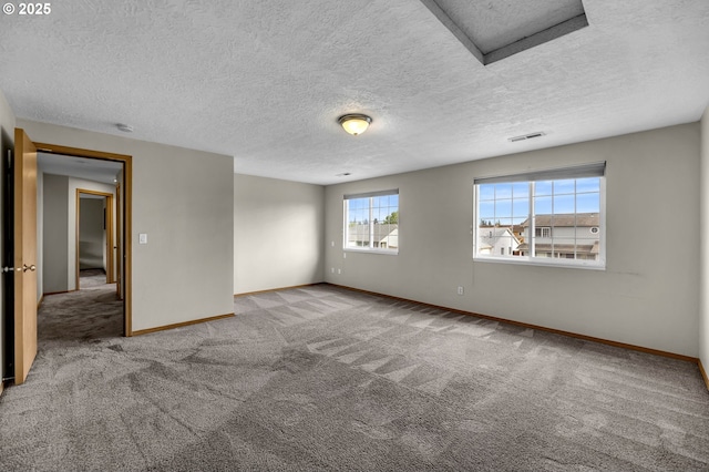 13306 NE 92nd St, Vancouver, WA 98682 - empty room with attic access, baseboards, carpet flooring, a textured ceiling, and a smoke detector