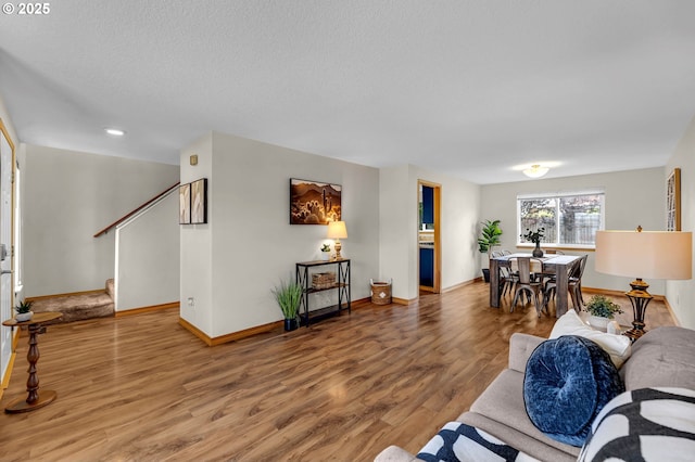 13306 NE 92nd St, Vancouver, WA 98682 - living room with wood finished floors, stairs, baseboards, recessed lighting, and a textured ceiling