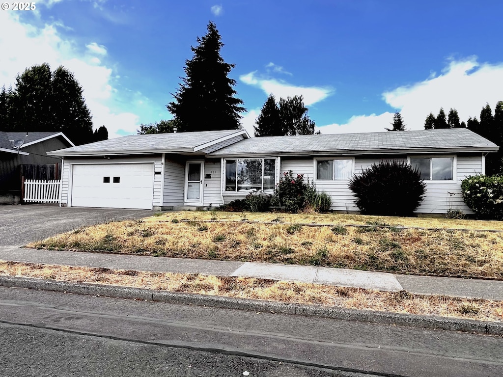 631 Willamina Ave, Forest Grove, OR 97116 - ranch-style house with an attached garage and driveway