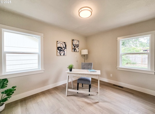 14127 SE Center St, Portland, OR 97236 - office area featuring light wood-style floors and baseboards