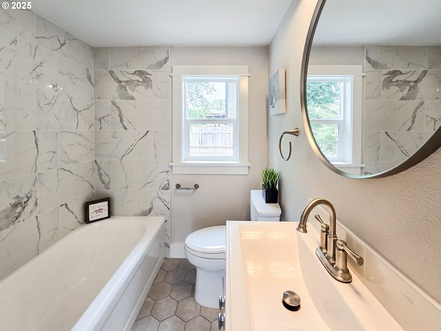 14127 SE Center St, Portland, OR 97236 - bathroom with healthy amount of natural light, tile patterned flooring, vanity, and shower / tub combination