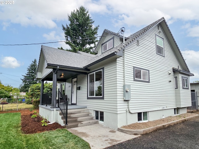 14127 SE Center St, Portland, OR 97236 - rear view of property featuring a porch