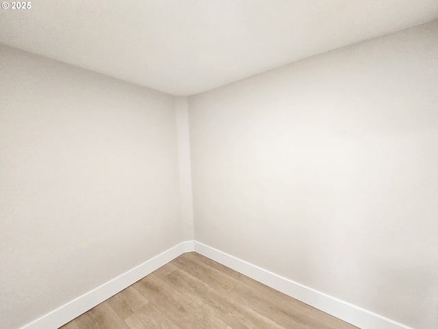 14127 SE Center St, Portland, OR 97236 - unfurnished room featuring light wood-style floors and baseboards