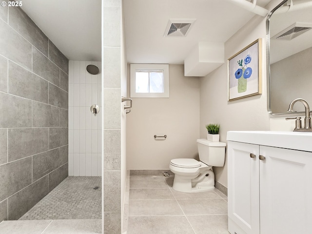 14127 SE Center St, Portland, OR 97236 - bathroom with a tile shower, tile patterned floors, and vanity