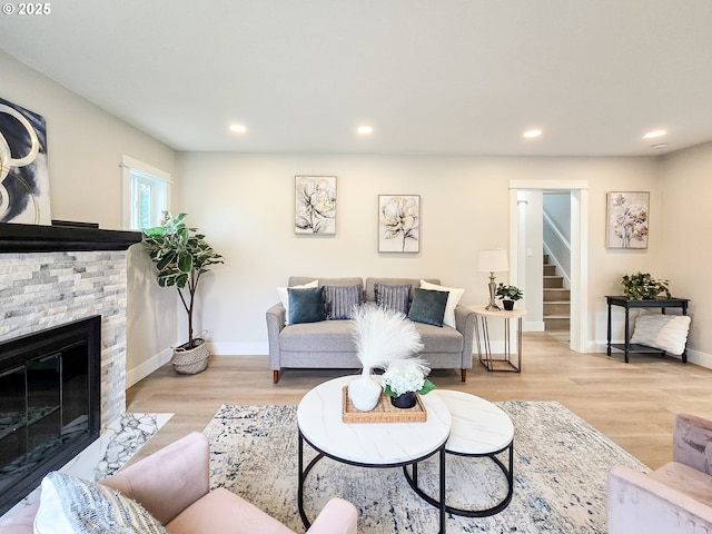 14127 SE Center St, Portland, OR 97236 - living room with a fireplace, stairway, recessed lighting, and wood finished floors