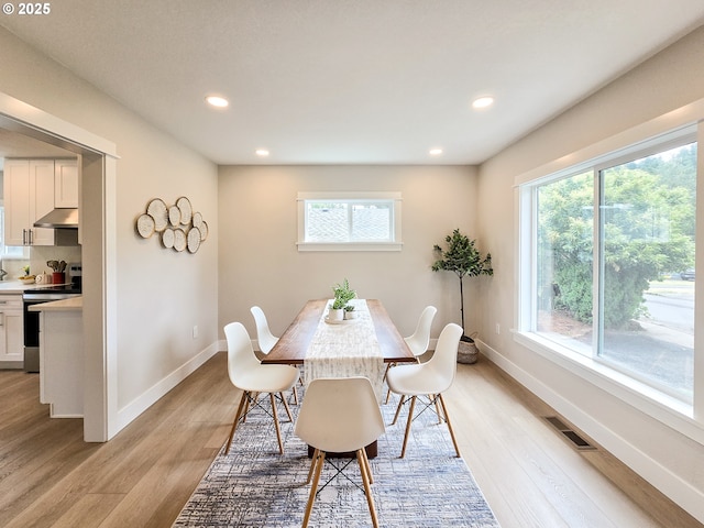 14127 SE Center St, Portland, OR 97236 - dining room with light wood-type flooring and recessed lighting