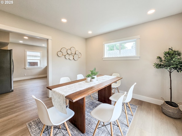 14127 SE Center St, Portland, OR 97236 - dining space featuring plenty of natural light, light wood-style flooring, and recessed lighting