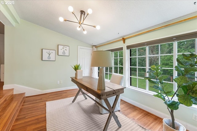 2906 SW Spring Garden St, Portland, OR 97219 - office area with a chandelier, vaulted ceiling, light wood-style floors, baseboards, and a textured ceiling