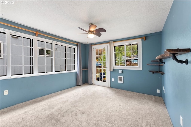 2906 SW Spring Garden St, Portland, OR 97219 - spare room featuring carpet floors, a ceiling fan, and a textured ceiling