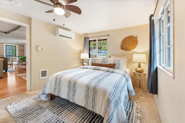 2906 SW Spring Garden St, Portland, OR 97219 - bedroom featuring a wall unit AC, carpet floors, heating unit, and ceiling fan