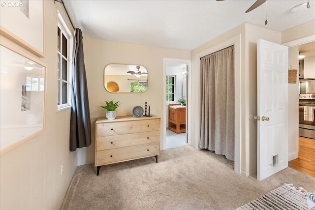 2906 SW Spring Garden St, Portland, OR 97219 - bedroom featuring light carpet and ceiling fan