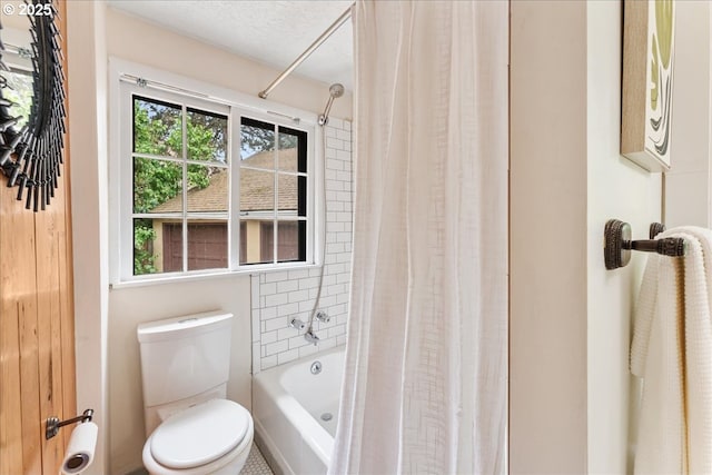 2906 SW Spring Garden St, Portland, OR 97219 - bathroom featuring toilet and shower / bath combination with curtain
