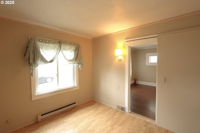 780 N 10th St, Coos Bay, OR 97420 - interior space with visible vents, light wood-type flooring, baseboards, and a baseboard radiator